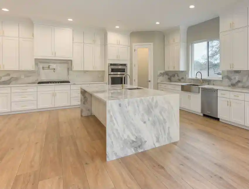 Kitchen restored by Braga Remodeling with new LVP flooring after water damage repairs